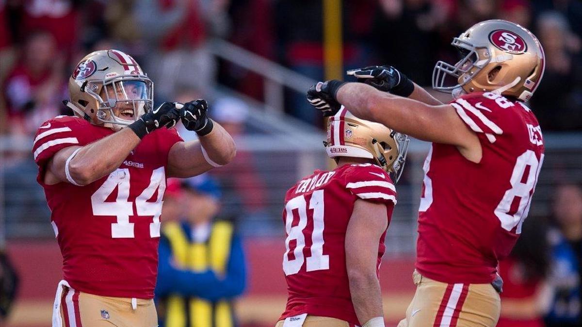 Tight end Garrett Celek, right and fullback Kyle Juszczyk celebrate Celek’s second-quarter touchdown for the 49ers during Sunday’s game against the Tennessee Titans at Levi’s Stadium.