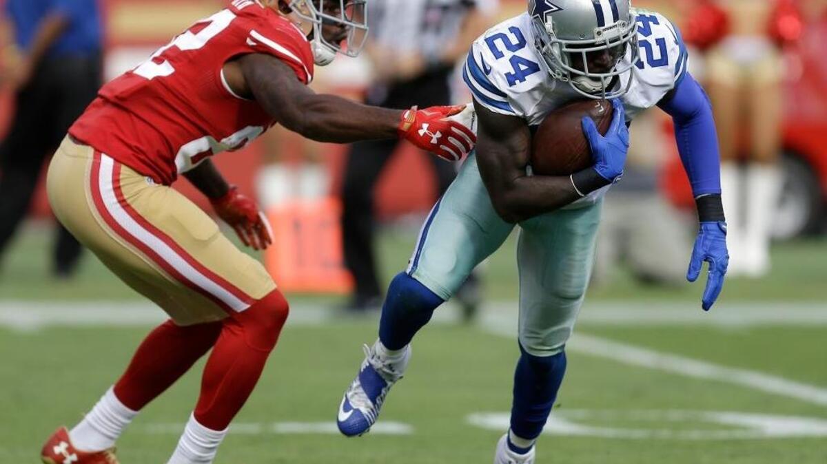 Dallas Cowboys cornerback Morris Claiborne (24) runs with an interception in front of San Francisco 49ers wide receiver Torrey Smith (82) during the second half of an NFL football game in Santa Clara, Calif., Sunday, Oct. 2, 2016.