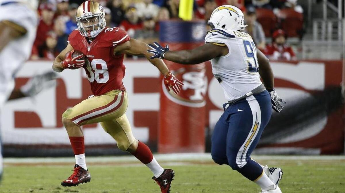 San Francisco 49ers running back Jarryd Hayne (38) picks up yardage against the San Diego Chargers during an NFL preseason football game, Thursday, Sept. 3, 2015 in Santa Clara.