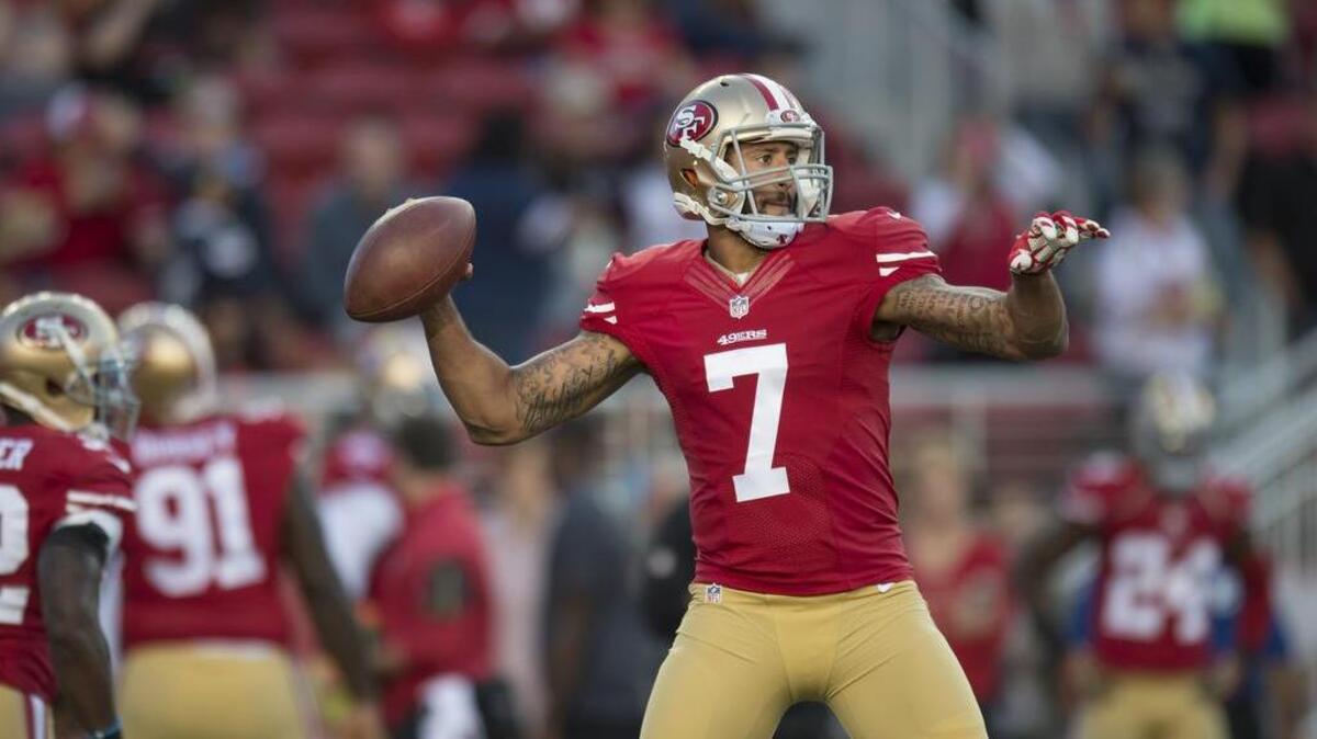 
Colin Kaepernick warms up before the 49ers’ final preseason game against San Diego on Thursday. The 49ers’ starting quarterback did not play in the game.
