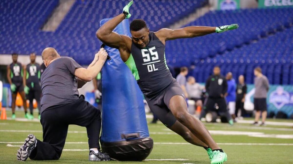 Eastern Kentucky defensive lineman Noah Spence runs a drill at the NFL football scouting combine in Indianapolis, Sunday, Feb. 28, 2016. (AP