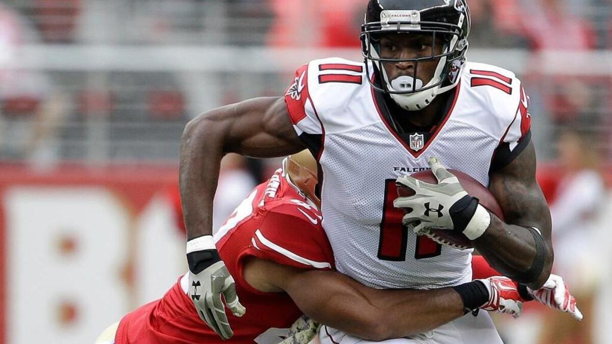 n this Nov. 8, 2015 file photo, Atlanta Falcons wide receiver Julio Jones (11) runs against San Francisco 49ers defensive back Marcus Cromartie during the first half of an NFL football game in Santa Clara, Calif. Jones is having another monster season, yet he hasn't scored a touchdown in more than a month. The Atlanta Falcons must turn that around to have any chance against unbeaten Carolina.