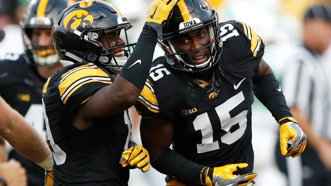 In this Sept. 16, 2017, file photo, Iowa’s Josh Jackson (15) celebrates with teammate Miles Taylor, left, after intercepting a pass during the second half of an NCAA college football game against North Texas, in Iowa City, Iowa.