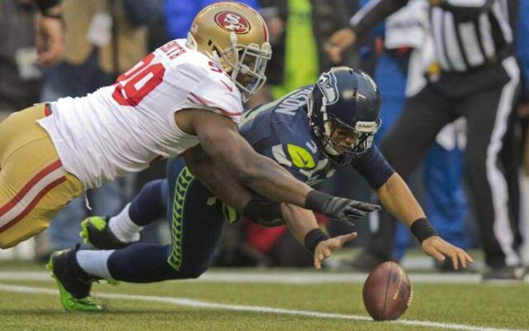 
The imminent return of Aldon Smith (99), going after the ball following a Russell Wilson fumble, is one of the biggest reasons there is optimism the 49ers’ second half of the season will be smoother than the first.
