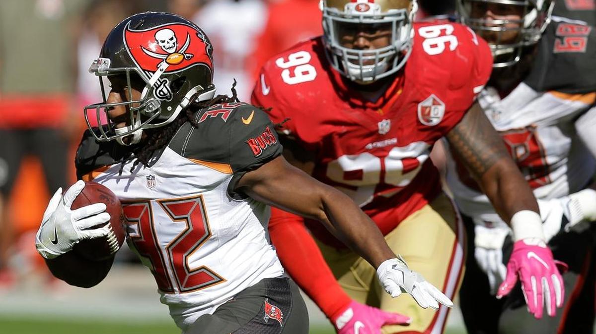 Tampa Bay Buccaneers running back Jacquizz Rodgers (32) runs in front of San Francisco 49ers defensive end DeForest Buckner (99) during the first half of an NFL football game in Santa Clara, Calif., Sunday, Oct. 23, 2016.