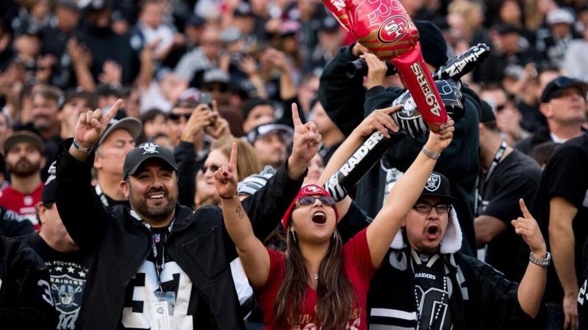 Raiders and 49ers fans cheer on their teams at Levi’s Stadium in Santa Clara on Dec. 7, 2014. The teams will learn their full schedule for the 2017-18 season Thursday.