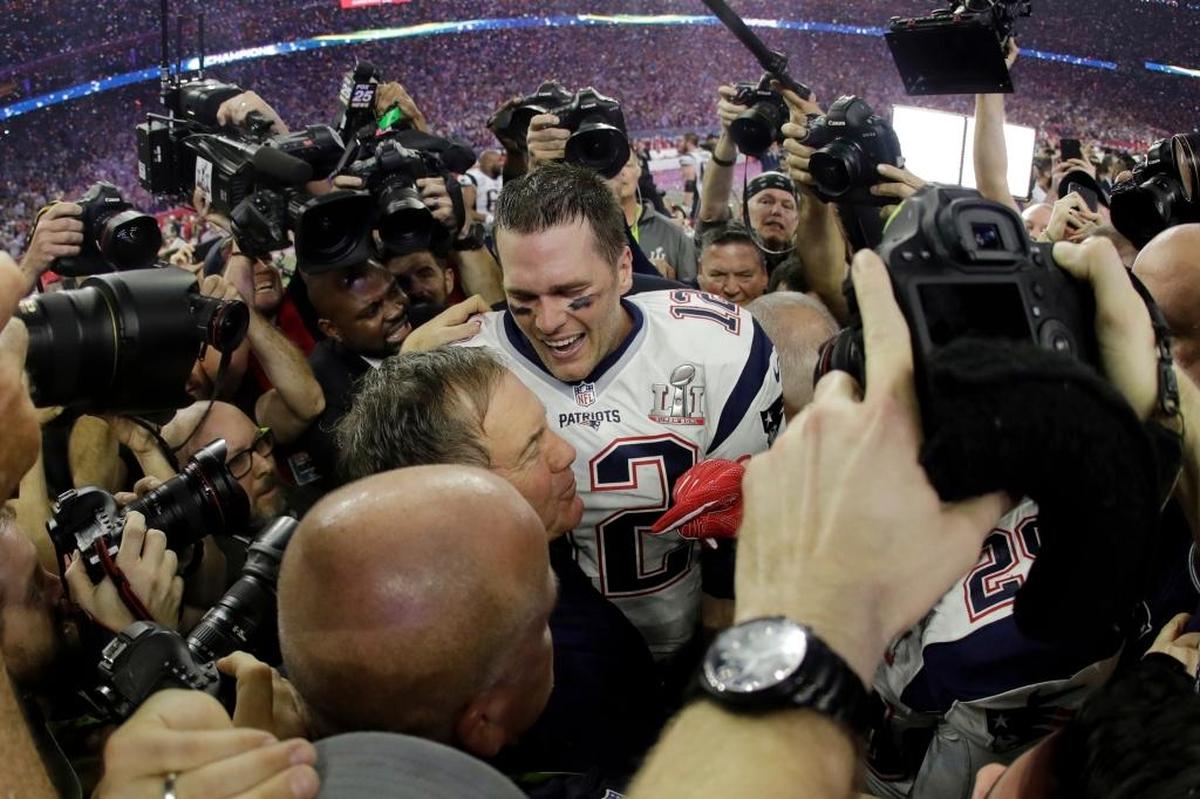 New England Patriots head coach Bill Belichick embraces quarterback Tom Brady after the Patriots defeated the Atlanta Falcons 34-28 in overtime on Sunday in Super Bowl 51 in Houston.