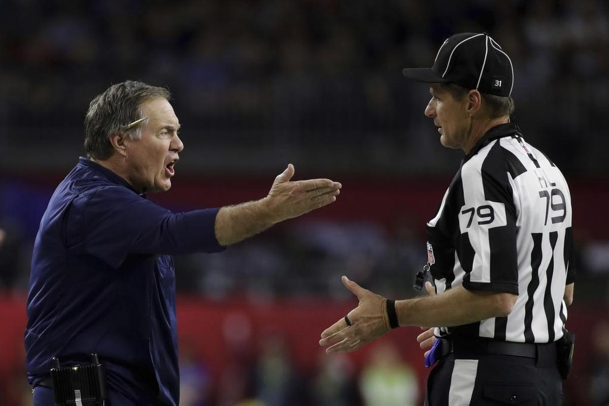 New England Patriots head coach Bill Belichick complains to head linesman Kent Payne (79), during the first half of Super Bowl 51 against the Atlanta Falcons on Sunday, Feb. 5, 2017, in Houston.