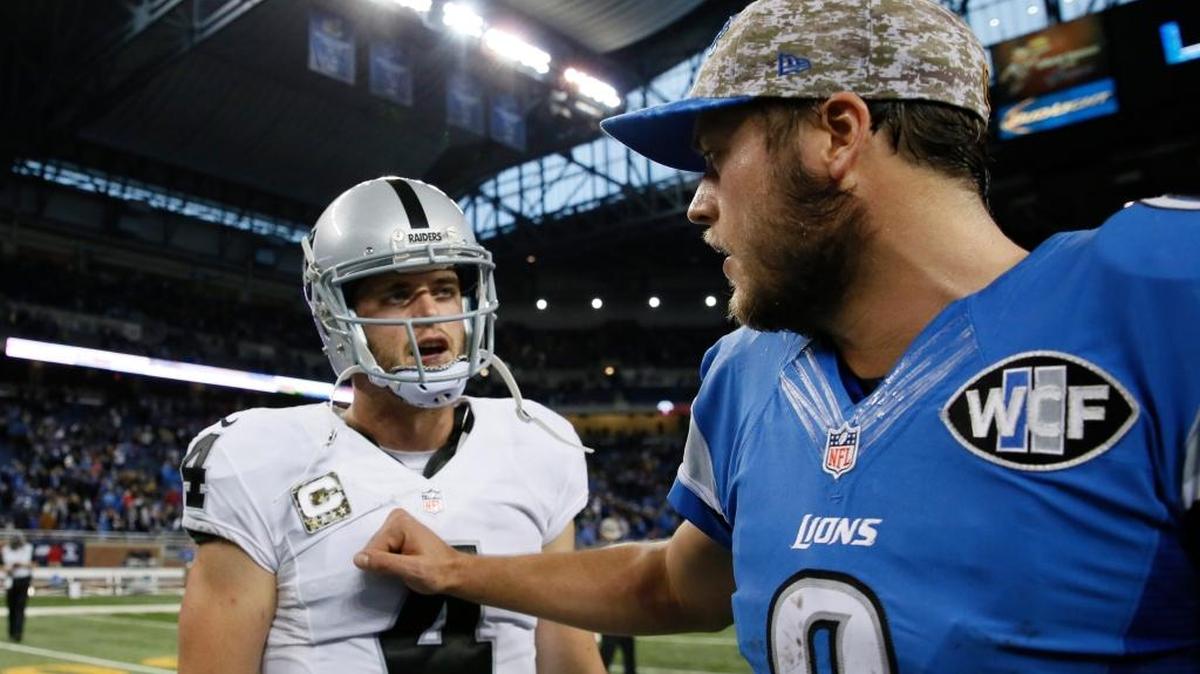 Raiders quarterback Derek Carr, left, was the highest-paid player in the NFL. That honor now reportedly belongs to Detroit Lions QB Matthew Stafford. They’re seen after a 2015 game in Detroit, won 18-13 by the Lions.
