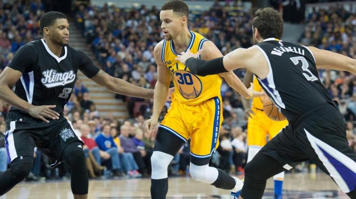 Golden State Warriors guard Stephen Curry (30) leads the NBA in scoring and is fourth in steals ... Curry passes the ball behind him as Sacramento Kings forward Rudy Gay (8) and Sacramento Kings guard Marco Belinelli (3) defend during an NBA basketball game on Saturday, Jan. 9, 2016 at Sleep Train Arena in Sacramento.