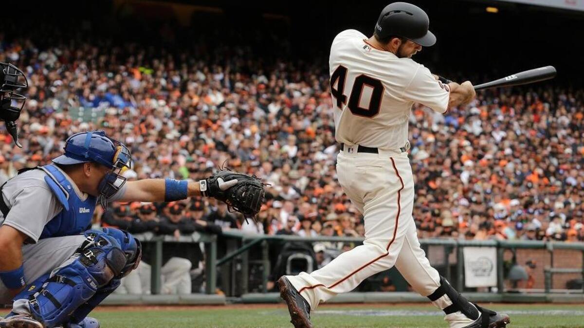 San Francisco Giants ace Madison Bumgarner (40) hits a solo home run off Los Angeles Dodgers ace Clayton Kershaw, not pictured, during the second inning of a baseball game on April 9, 2016, in San Francisco.