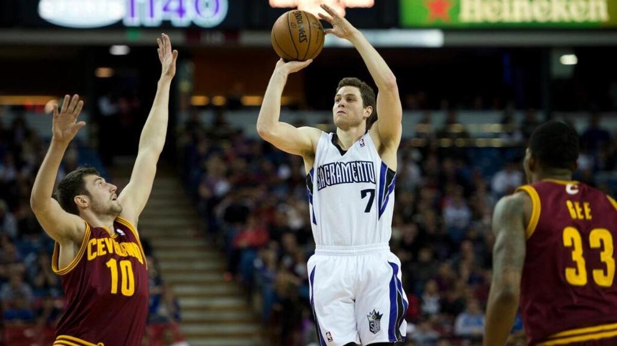 Sacramento Kings point guard Jimmer Fredette (7) shoots over Cleveland Cavaliers shooting guard Sergey Karasev (10) during an NBA basketball game on Sunday, Jan. 12, 2014 at Sleep Train Arena in Sacramento.