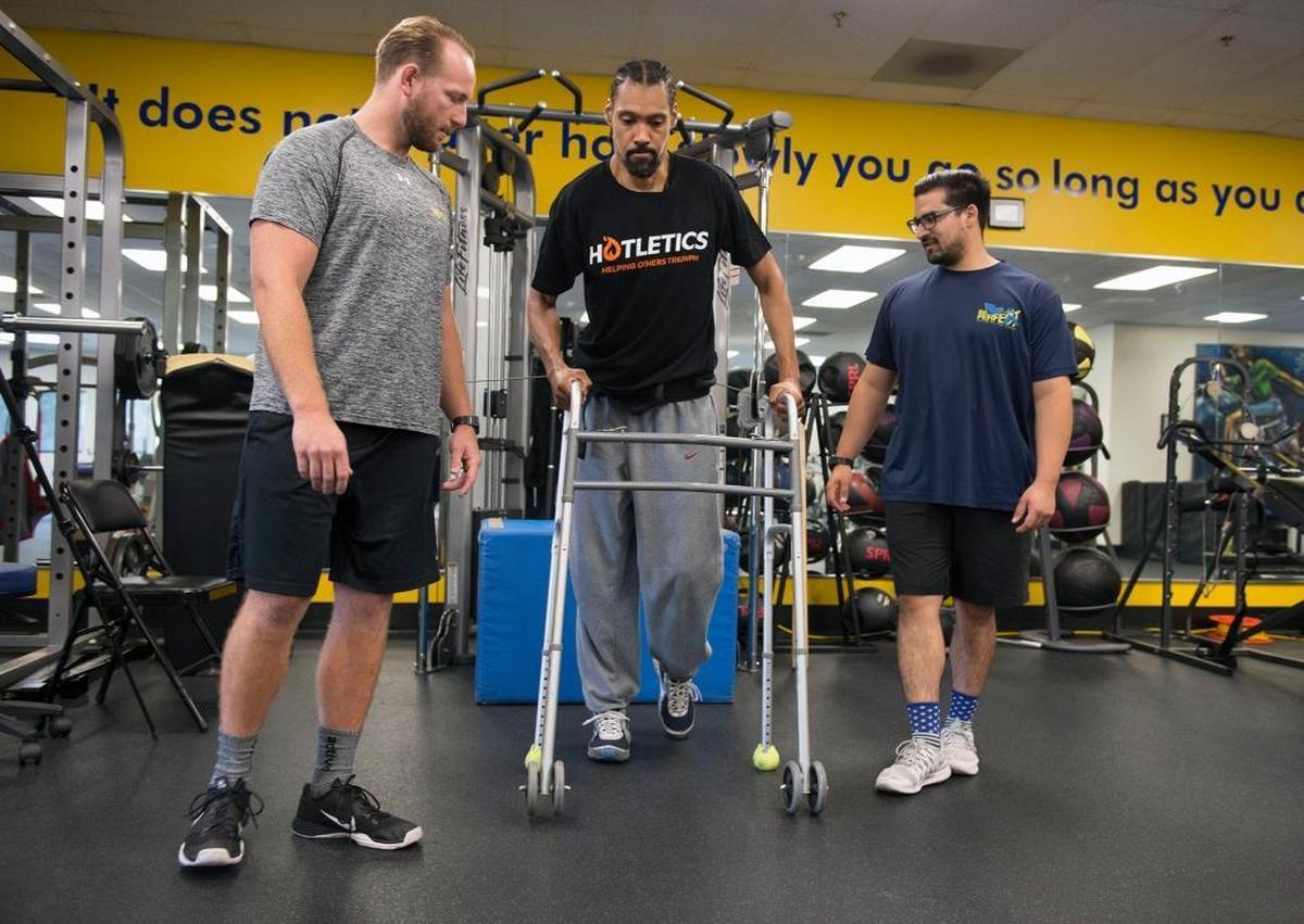 Two-time Olympic high jumper and Sacramento native Jamie Nieto goes through a strengthening exercise with Skye Severns, left, and Joshua Herrera at Project Walk in Los Angeles County, which specializes in neck and spinal cord recovery on Wednesday, July 5, 2017 in Claremont, Calif. Nieto was paralyzed in 2016 when he attempted a back flip, but caught his foot on liftoff and landed on his head.