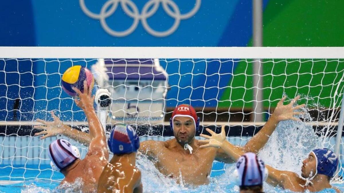 Italy’s Stefano Tempesti, center, tries to stop a shot by United States’ Alex Obert, left, during their men’s water polo preliminary round match at the 2016 Summer Olympics in Rio de Janeiro on Sunday, Aug. 14, 2016. Obert, a Del Oro High School graduate, scored twice in a 10-7 win that ended the Americans’ run in Rio.