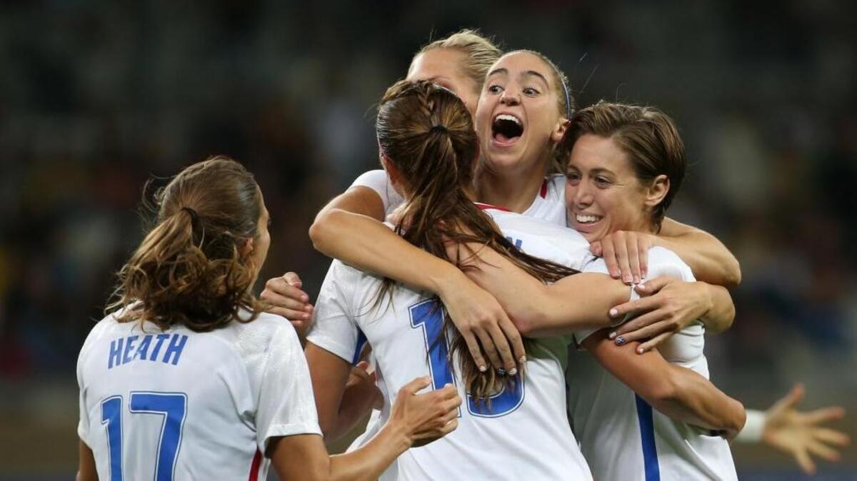 Morgan Brian, second right, of the United States celebrates with her teammates after Alex Morgan scored the team’s second goal against New Zealand during Wednesday’s Olympic match at the Mineirao stadium in Belo Horizonte, Brazil. The United States won 2-0.