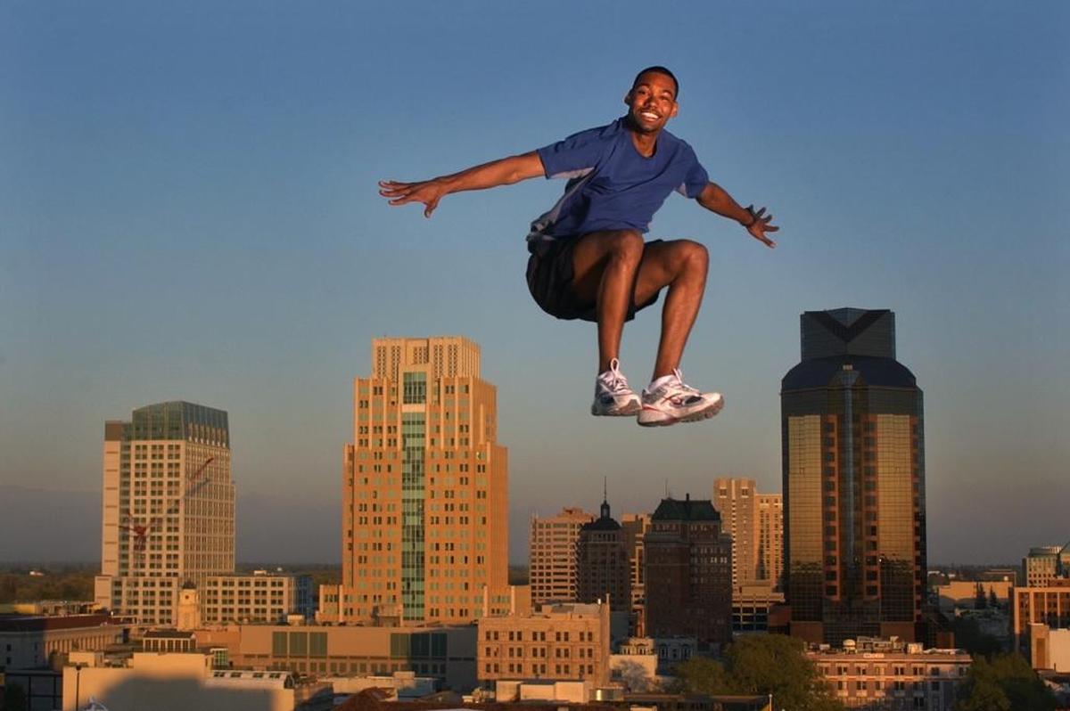 Jamie Nieto, a graduate of Valley High School who also attended Sac City College, is photographed from atop the Holiday Inn with the downtown Sacramento skyline looming behind in 2004.