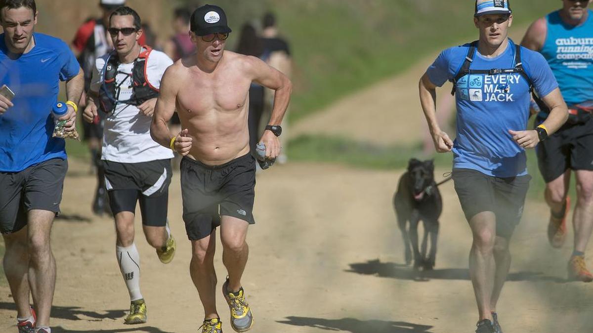 Runners, including Lance Armstrong, shirtless third from left, pass "no Hands bridge" during a training run for the Western States 100 endurance run in Auburn on Saturday, February 13, 2016.