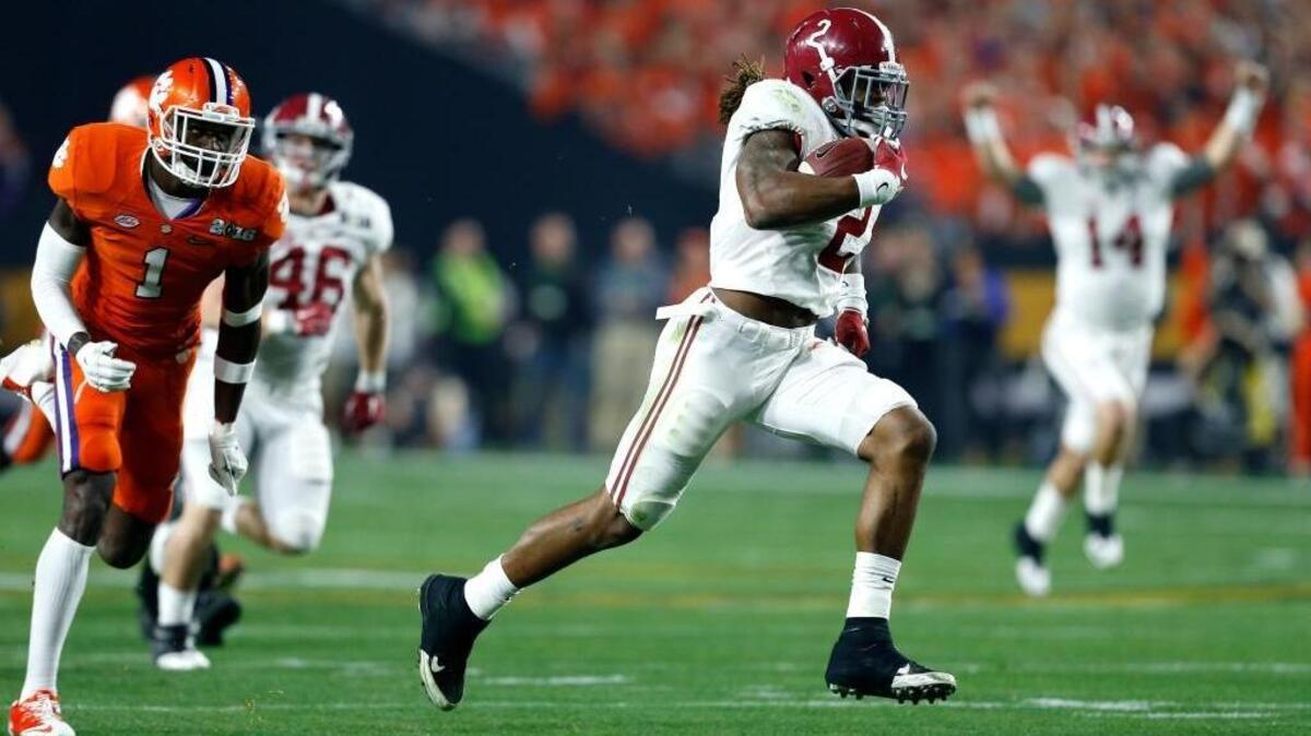 Alabama running back Derrick Henry (2) breaks free for a touchdown as quarterback Jake Coker (14) celebrates during the Playoff Championship NCAA football game against Clemson, Tuesday, Jan. 12, 2016, in Glendale, AZ.