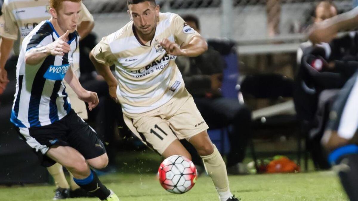 
Newcastle United forward Yoan Gouffran (11), defends as Sacramento Republic FC midfielder Max Alvarez (11), looks for space during the friendly soccer match at Bonney Field on July 18.
