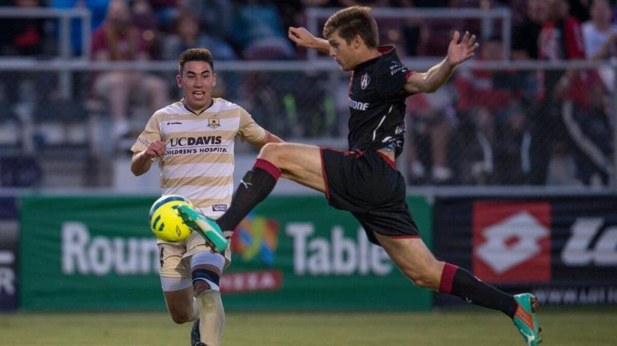 Sacramento Republic FC forward Cameron Iwasa, left, has his pass blocked by Atlas F.C. defender Walter Kannemann in a friendly at Bonney Field on Wednesday, July 8, 2015, in Sacramento.