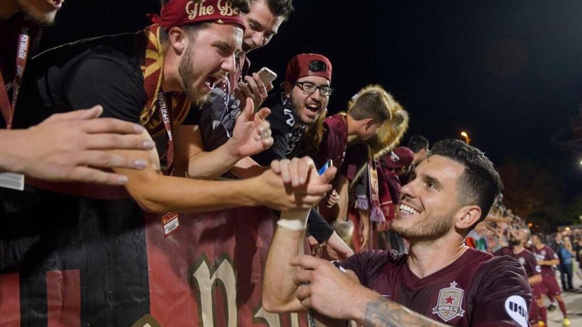 FILE - Republic FC fans and members of the Tower Bridge Battalion congratulate Republic FC defender Emrah Klimenta (23) following the match between the Sacramento Republic FC and the Orange County SC at Papa Murphy’s Park in Sacramento on Saturday, April 1, 2017. Klimenta scored the lone goal in Republic FC’s 1-1 draw against San Antonio FC on Saturday, July 1, 2017.