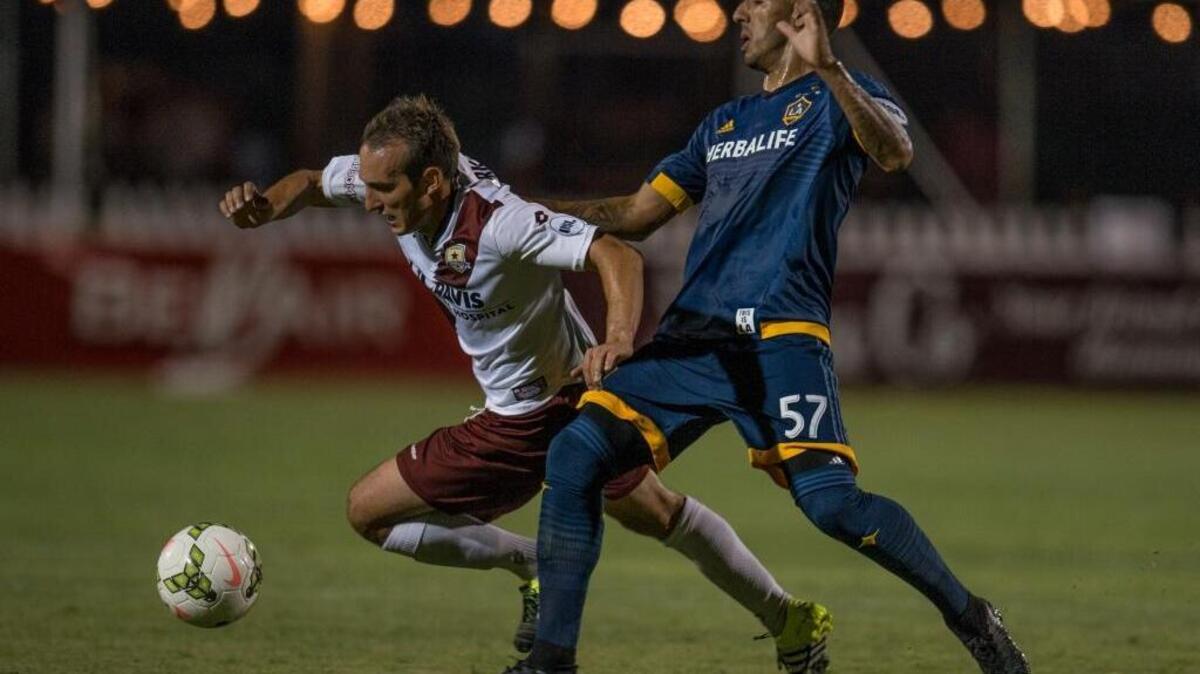 
Sacramento Republic FC midfielder Ivan MirkoviÄa (18) fights for the ball against LA Galaxy II midfielder Alejandro Covarrubias (57) during the first half at a playoff game between the Sacramento Republic FC and LA Galaxy II on Saturday, Sept. 26, 2015.
