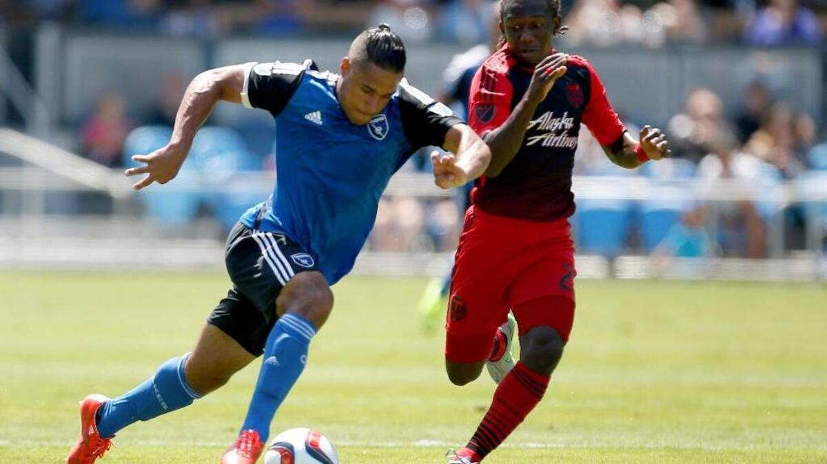 The San Jose Earthquakes’ Quincy Amarikwa, left, and Portland Timbers midfielder Diego Chara, right, race for the ball during an MLS match Sunday, August 2, 2015, in San Jose. Two seasons ago, both teams sent players to Republic FC. Coach Paul Buckle sees the relationship with the Earthquakes strengthening in 2016.