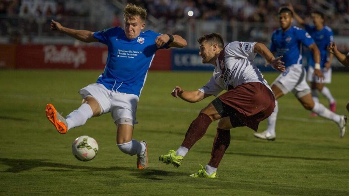
Republic FC’s Thomas Stewart, middle, has his shot blocked by Colorado Springs’ Josh Phillips on Saturday at Bonney Field.
