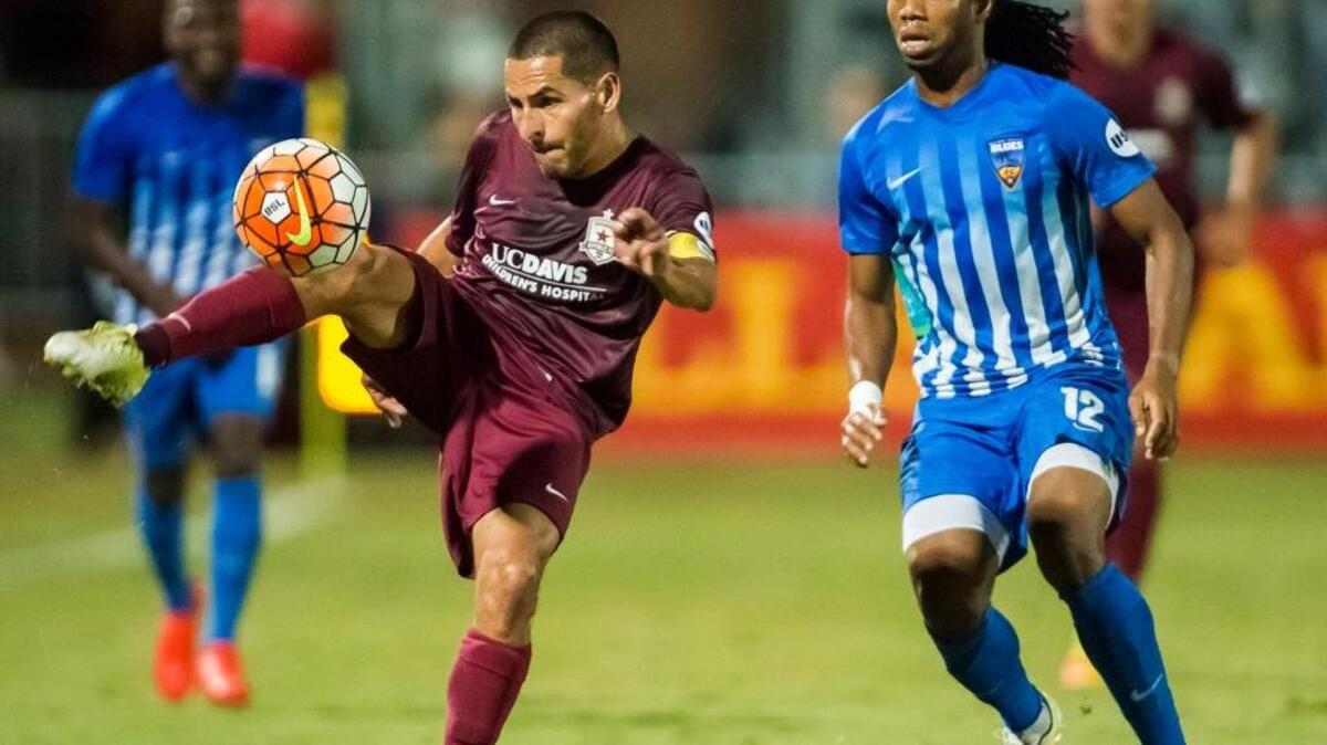 Republic FC Danny Barrera, left, and Orange County Blues FC Andrae Campbell fight for the ball during a USL Western Conference playoff game on Oct. 1, 2016, in Sacramento.