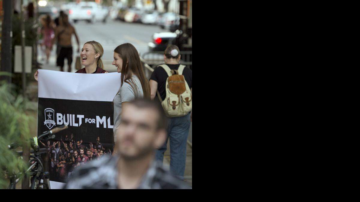 
Erica Jahn carries a sign in September backing the Sacramento Republic FC at a rally when Major League Soccer representatives were in town.

