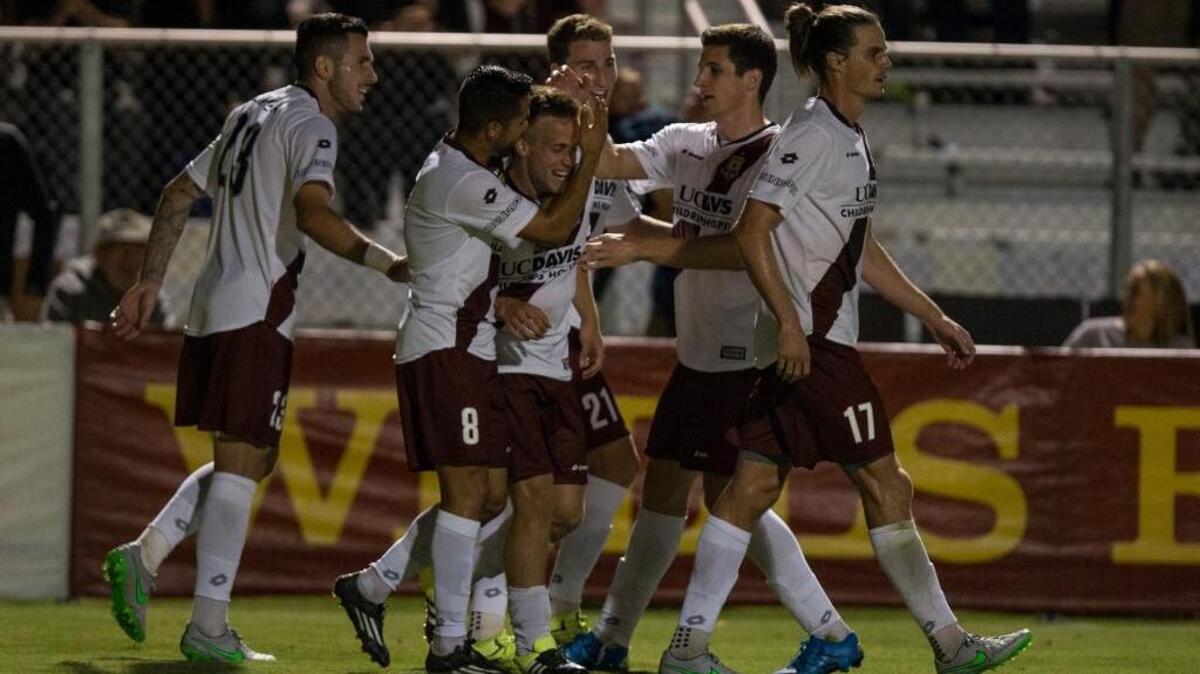 
Sacramento Republic FC midfielder Danny Barrera (5) celebrates with his teammates after scoring the first goal in the first half of Saturday night’s game between Republic FC and the Tulsa Roughnecks FC at Bonney Field in Sacramento.

