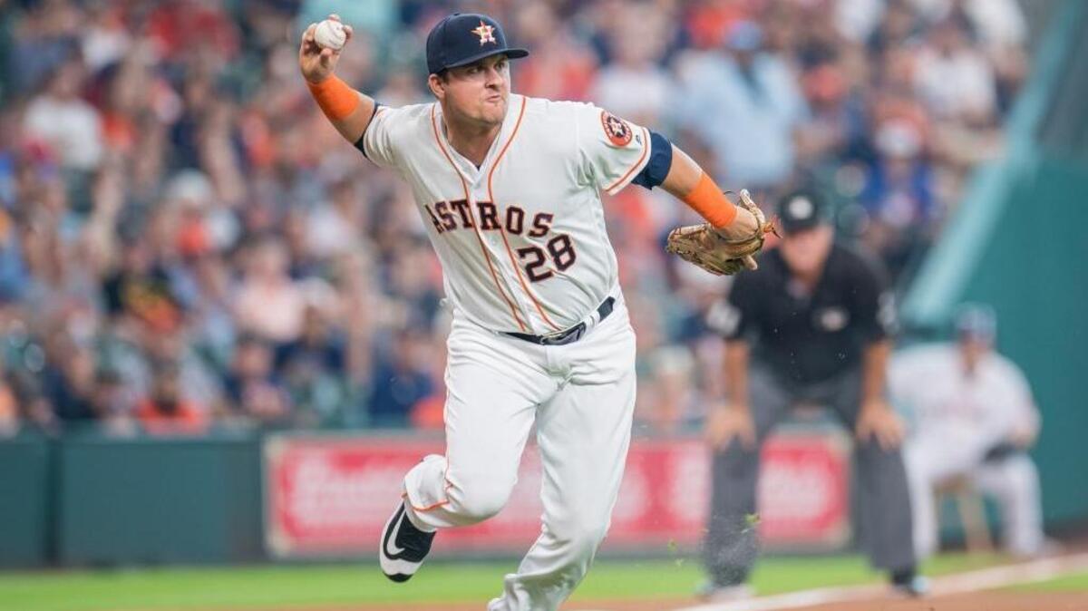 J.D. Davis fires to first base after fielding a slow roller at third, one of five positions he played for the Houston Astros. The Elk Grove resident recently was traded to the New York Mets.