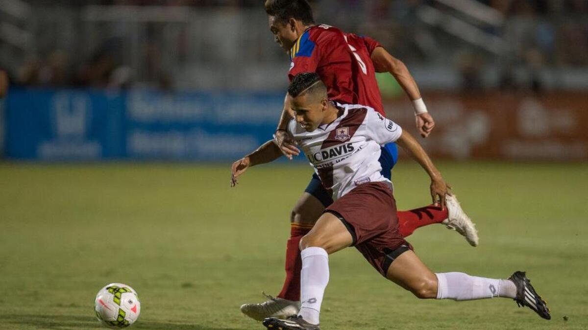 
Republic FC midfielder Rodrigo Lopez (8) fights for the ball against Real Monarchs SLC midfielder Alec Sundly (6) on Aug. 22 in Sacramento.
