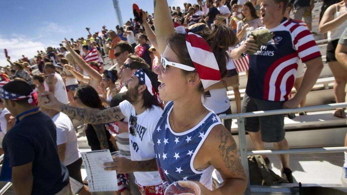 Roxanne Everhard of Napa, center and other fans cheer from the stands during a rugby match between the USA Men's Eagles and Rugby Canada at Bonney Field in Sacramento on Saturday, June 21, 2014.