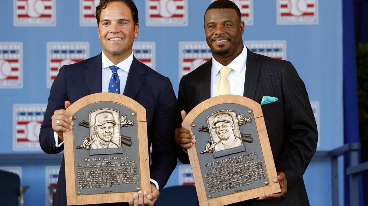 National Baseball Hall of Fame inductees Mike Piazza, left, and Ken Griffey Jr. hold their plaques after an induction ceremony at the Clark Sports Center on Sunday, July 24, 2016, in Cooperstown, N.Y.