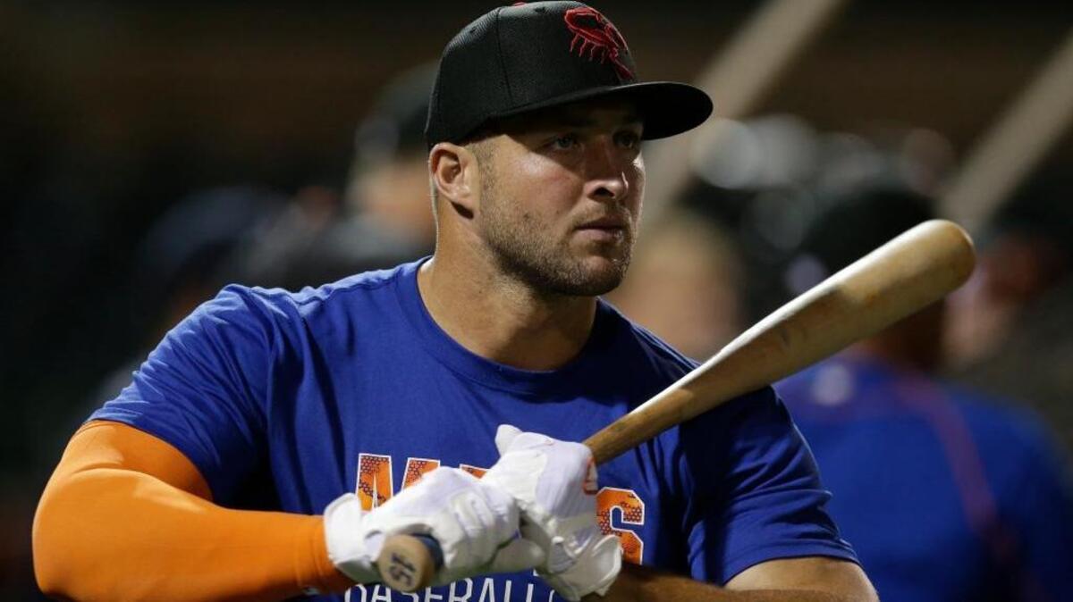 Former NFL quarterback Tim Tebow warms up before practice for the Arizona Fall league, Monday, Oct. 10, 2016, in Scottsdale, Ariz.