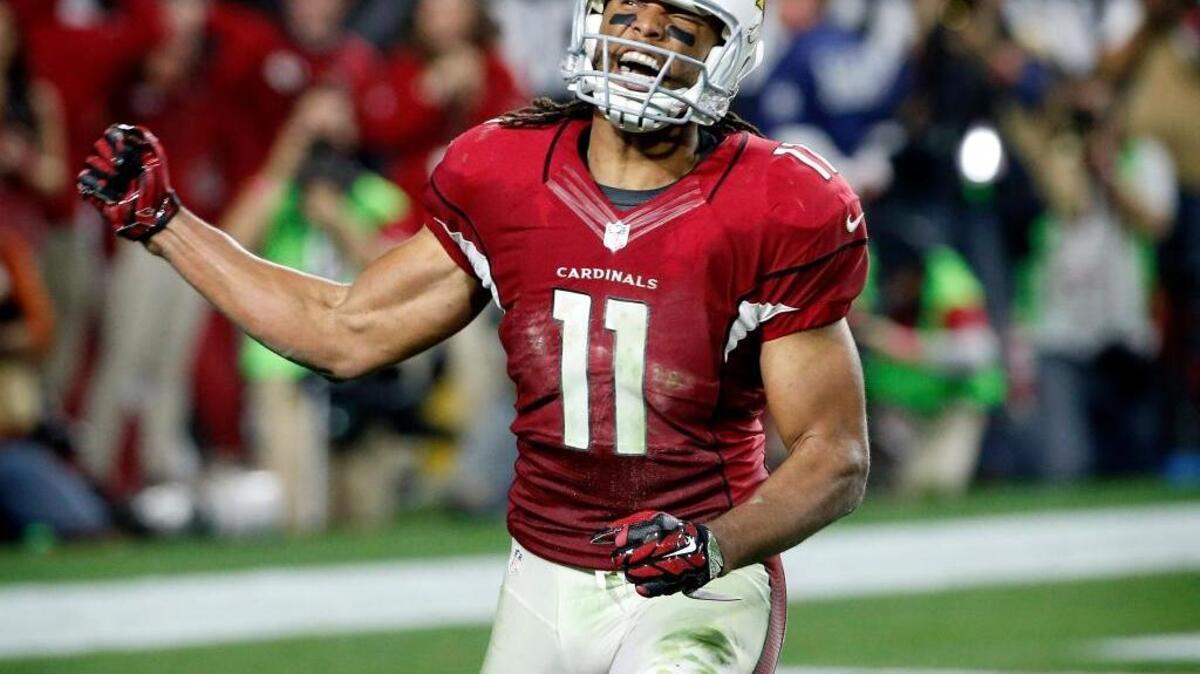 Arizona Cardinals wide receiver Larry Fitzgerald (11) celebrates his 75-yard reception to set up a game-winning touchdown against the Green Bay Packers during the second half of an NFL divisional playoff football game, Saturday, Jan. 16, 2016, in Glendale, Ariz. The Cardinals won 26-20 in overtime.