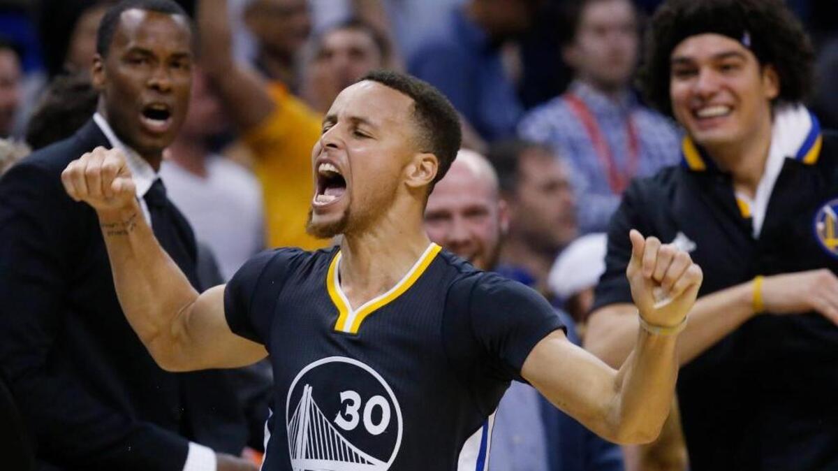 Golden State Warriors guard Stephen Curry (30) celebrates after hitting his game-winning three-point shot in overtime of an NBA basketball game against the Oklahoma City Thunder in Oklahoma City, Saturday, Feb. 27, 2016. Golden State won 121-118 to improve to 53-8. Curry tied an NBA single-game record with 12 made-threes, and broke the mark for most made-threes in a season with his 288th.