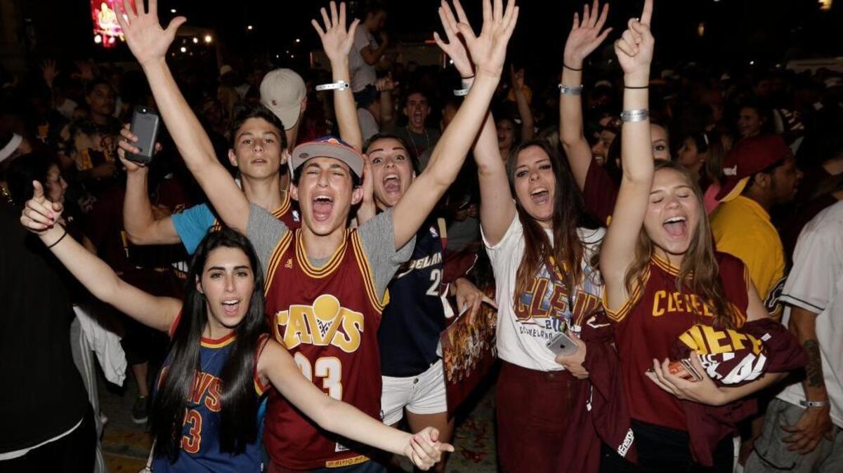 Cavaliers fans celebrate in Cleveland after their team beat the Warriors in Game 7 of the NBA Finals in Oakland on Sunday.
