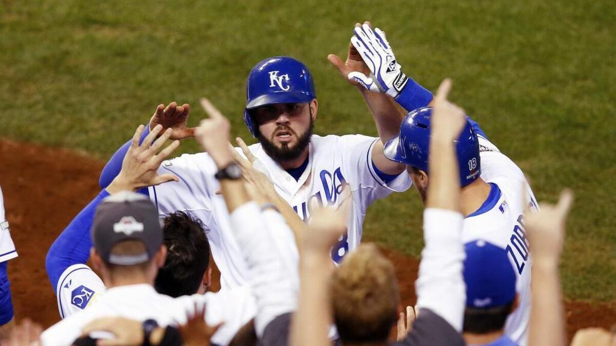 Kansas City’s Mike Moustakas celebrates after scoring on a hit by Alex Rios during the seventh inning against Toronto in Game 6 of the ALCS in Kansas City, Mo., Friday, Oct. 23, 2015. The Kansas City Royals beat the Toronto Blue Jays 4-3 to advance to the World Series to play the New York Mets.