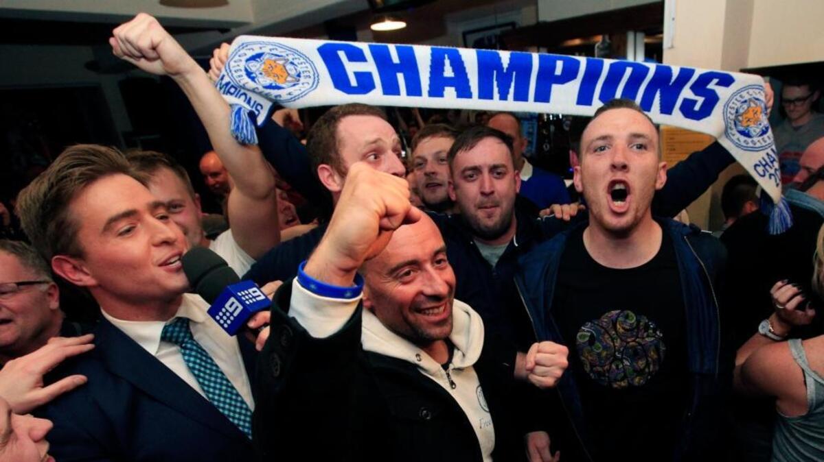 Leicester City fans celebrate in the Market Tavern in Leicester after seeing their side crowned English Premier League soccer champions following Tottenham Hotspur’s 2-2 draw against Chelsea. The match resulted in Leicester City winning the Premier League, Monday May 2, 2016.