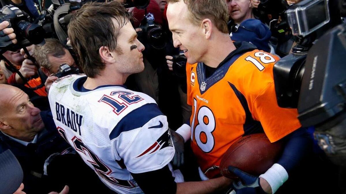 New England Patriots quarterback Tom Brady, left, and Denver Broncos quarterback Peyton Manning speak following the NFL football AFC Championship game Sunday, Jan. 24, 2016, in Denver. In the final Manning vs. Brady matchup, the Broncos defeated the Patriots 20-18 to advance to the Super Bowl.