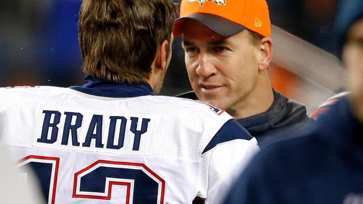 New England Patriots quarterback Tom Brady (12) greets Denver Broncos injured quarterback Peyton Manning before an NFL football game, Sunday, Nov. 29, 2015, in Denver. The Broncos won 30-24 in overtime, handing the Patriots their first loss after going 10-0.